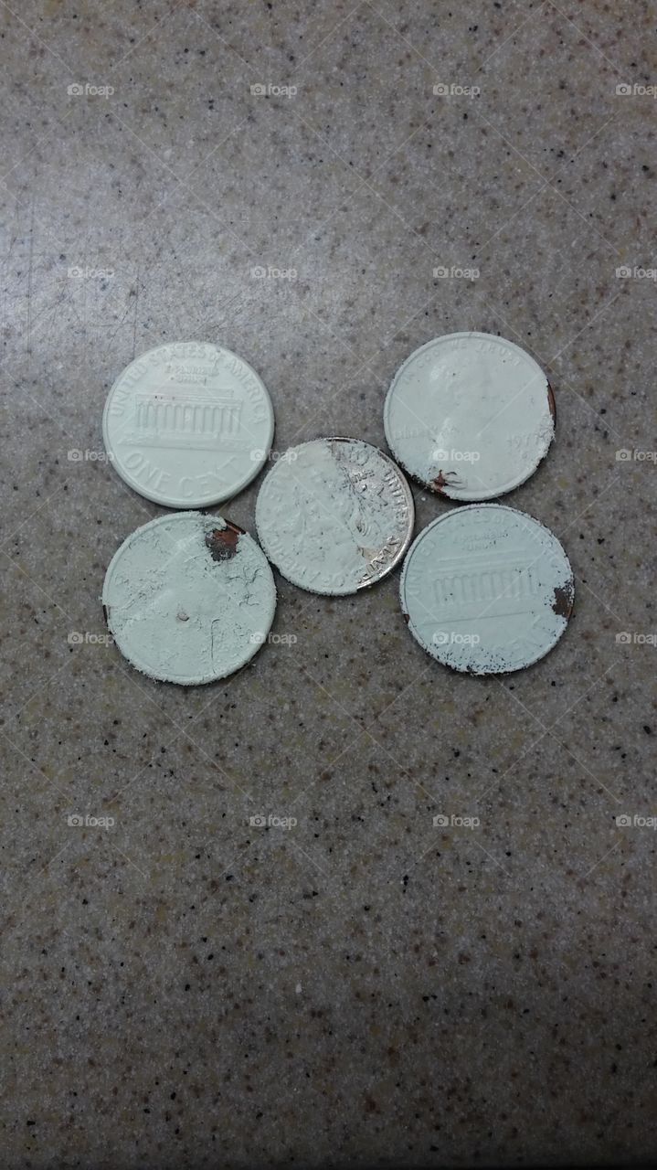 painted money, 4 pennies and a dime.