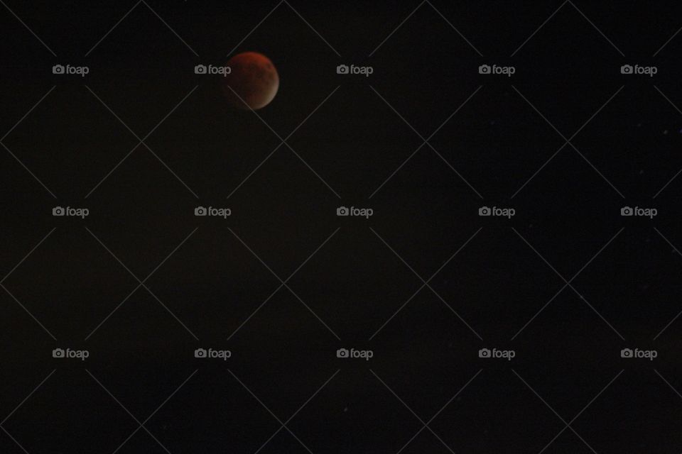 Lunar Eclipse. The supermoon is almost completely covered by the earth's shadow during the lunar eclipse happened on September 27, 2015