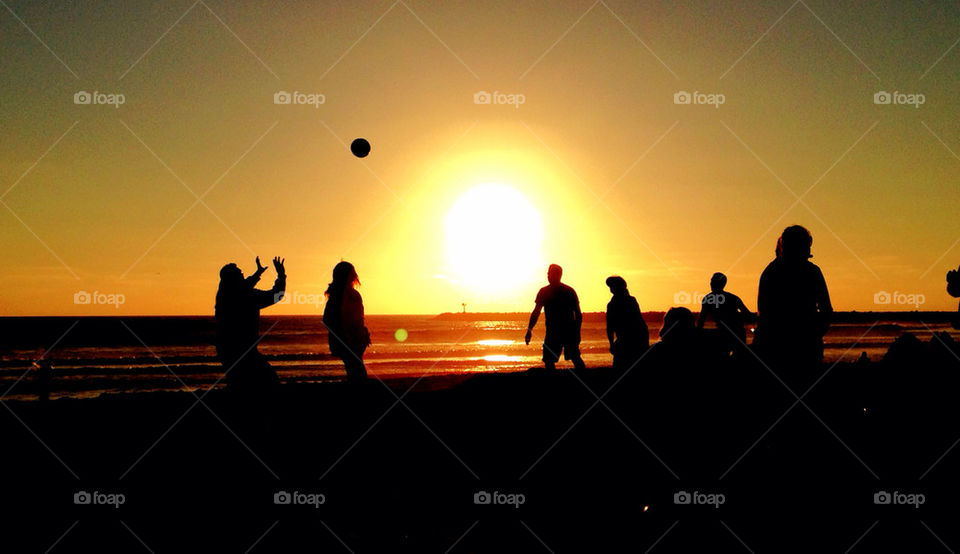 volleyball beach ocean people by andrele