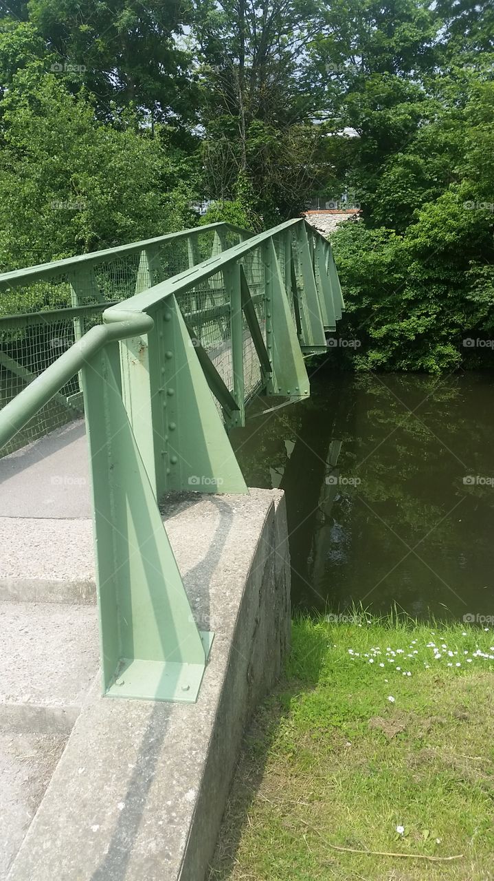 bridge over a clear river