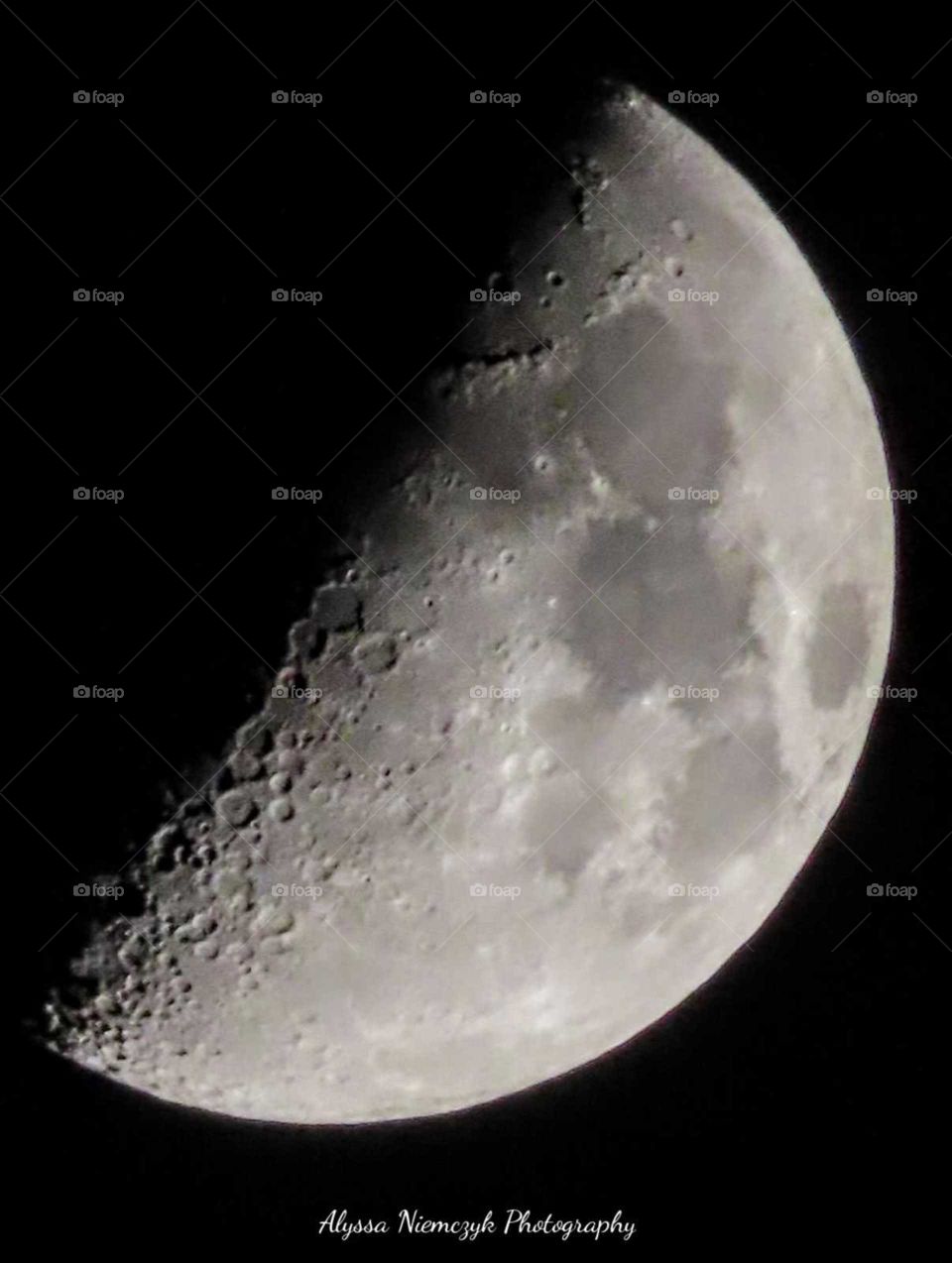 Stunning moon phase close up. Craters showing. Moon beams light the way to a peaceful evening.