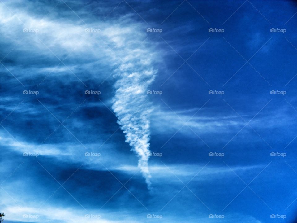 tornado shaped cloud. this cloud looks like a vapor tornado