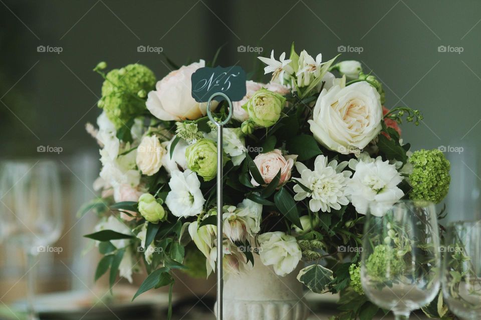 Bouquet of flowers in a vase on a festive decorated table