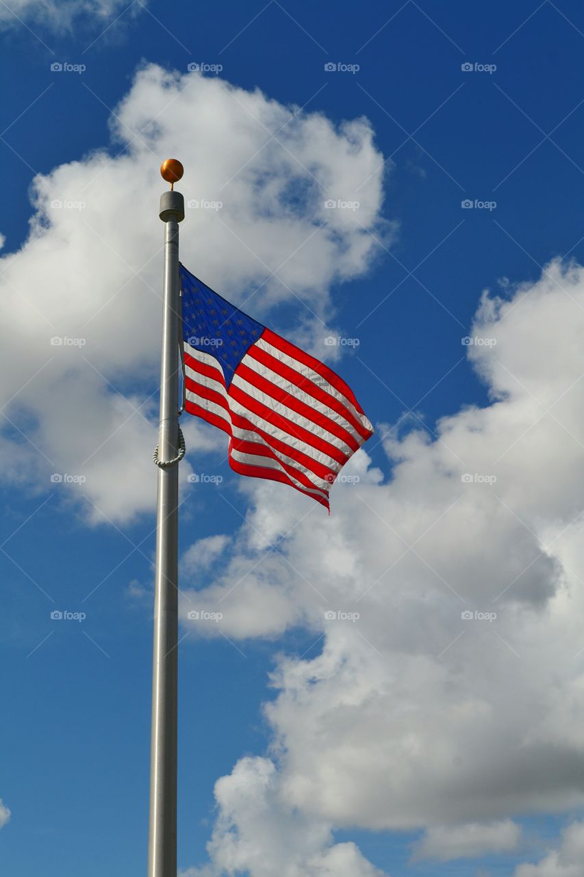 American flag on the blue sky