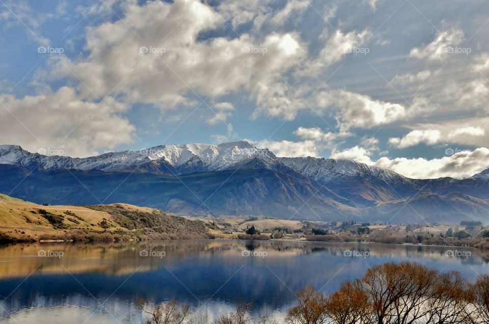 Scenic view of lake near snowy mountain