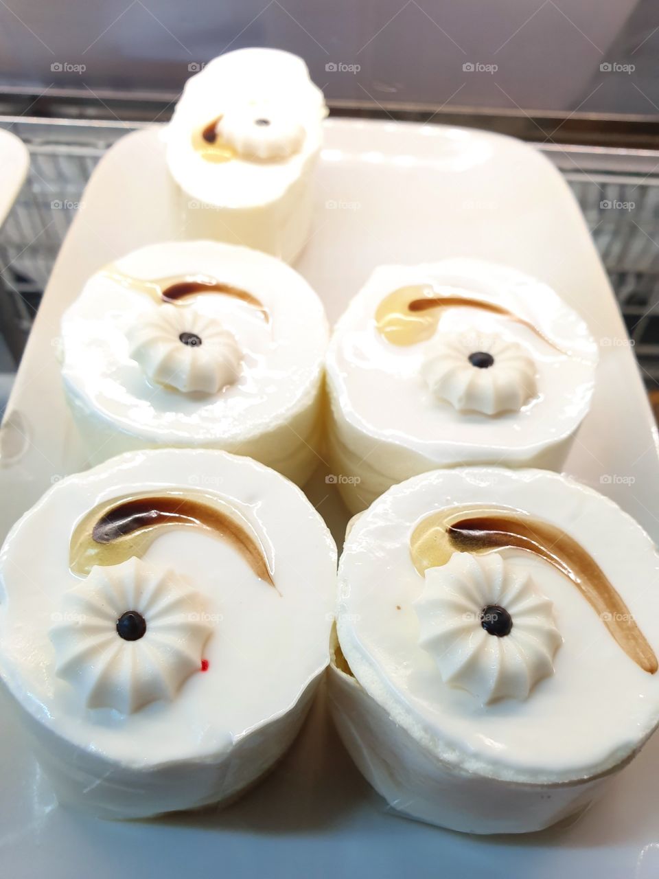 white decorated mini cakes
