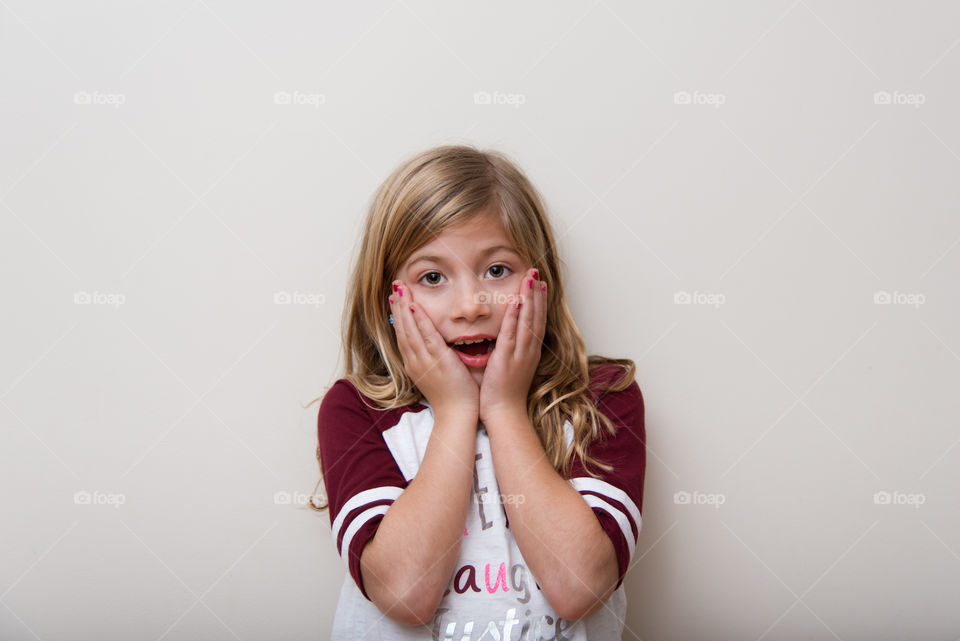 Portrait of girl looking surprised