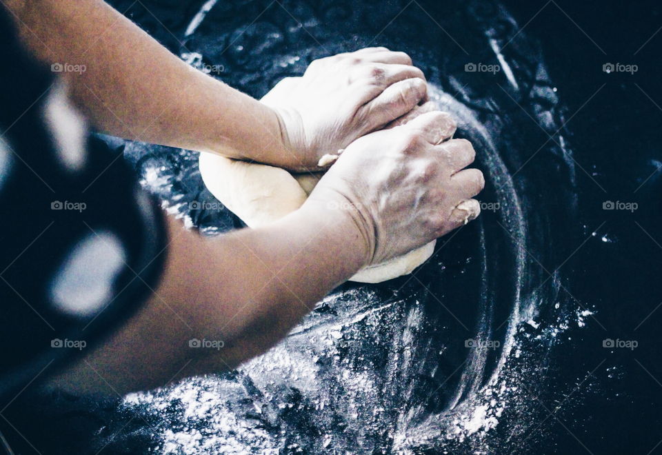 Man kneading dough