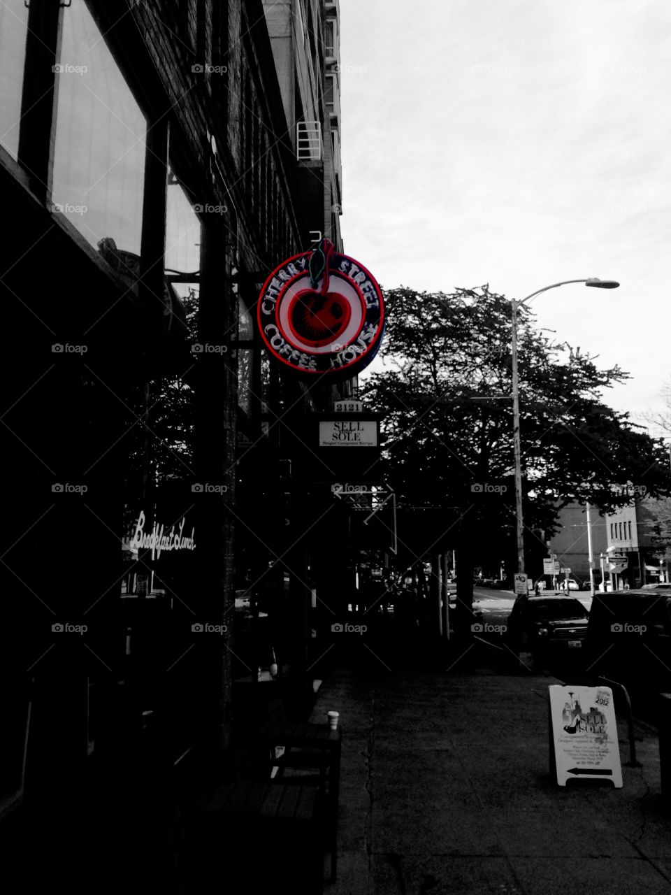 My love for cities is strong. Black and white photo with the "Cherry Street Coffee House" sign in color. In Seattle, Washington