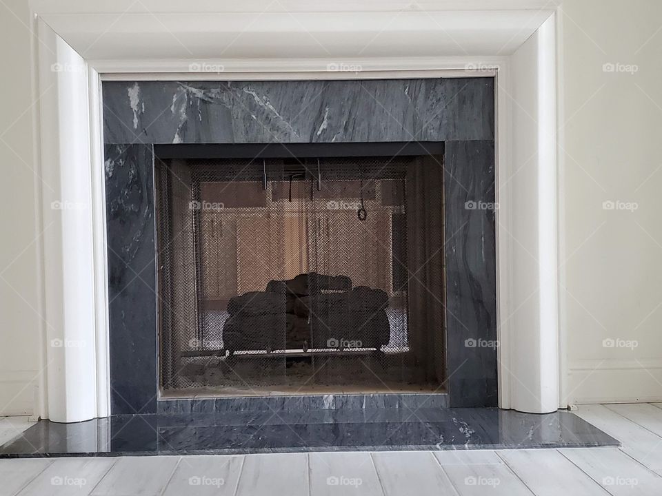 Chocolate brownies on a green glass plate with a white background 