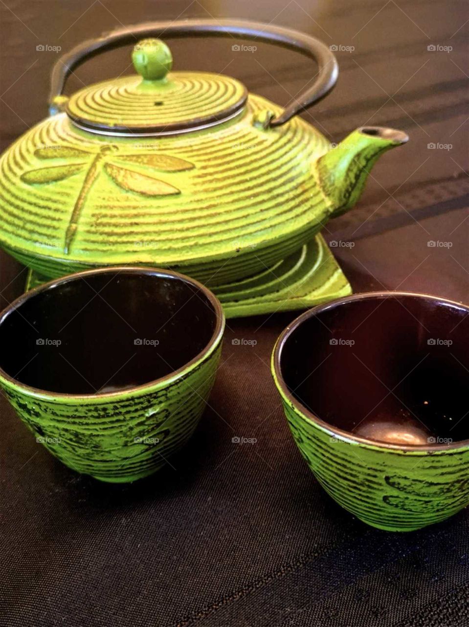 drinking japanese tea with a green teapot