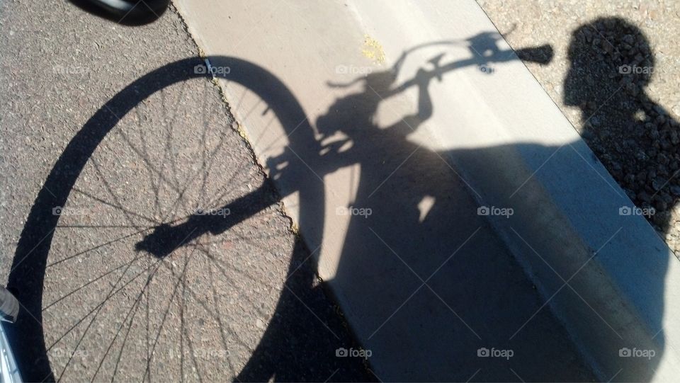 Shadow of bike rider