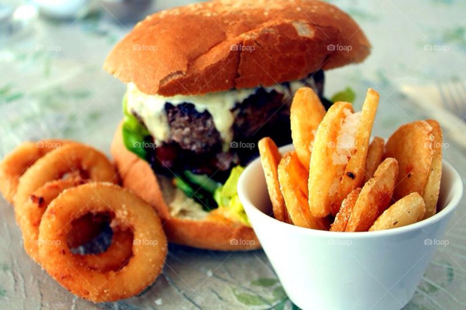 High angle view of cheeseburger with onionring