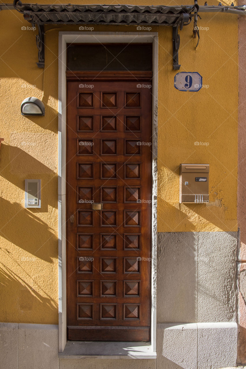 Old door in the city of Cefalu on Sicily.