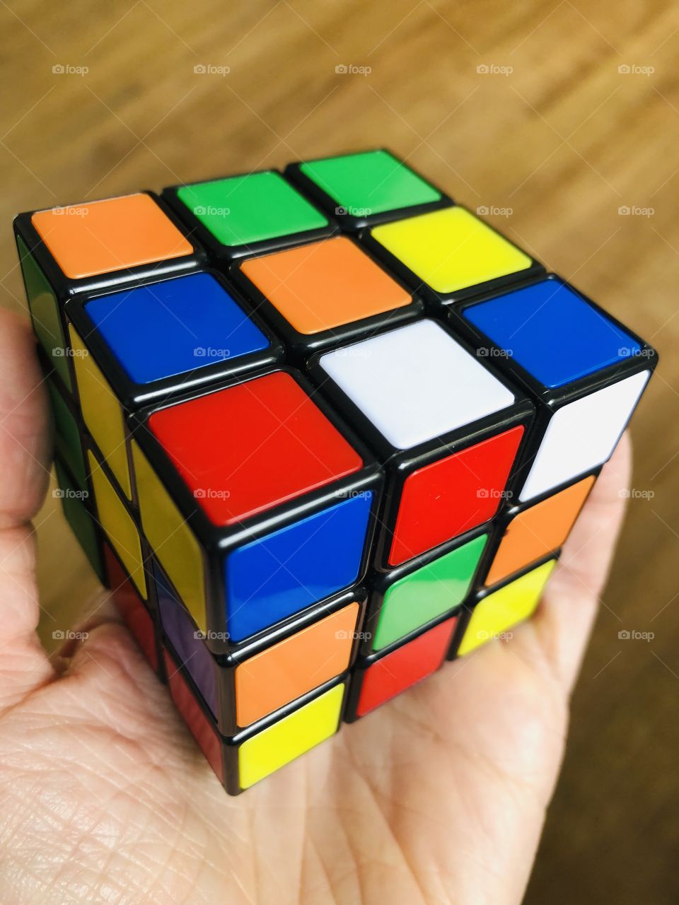 Hand holding a Rubik’s cube 