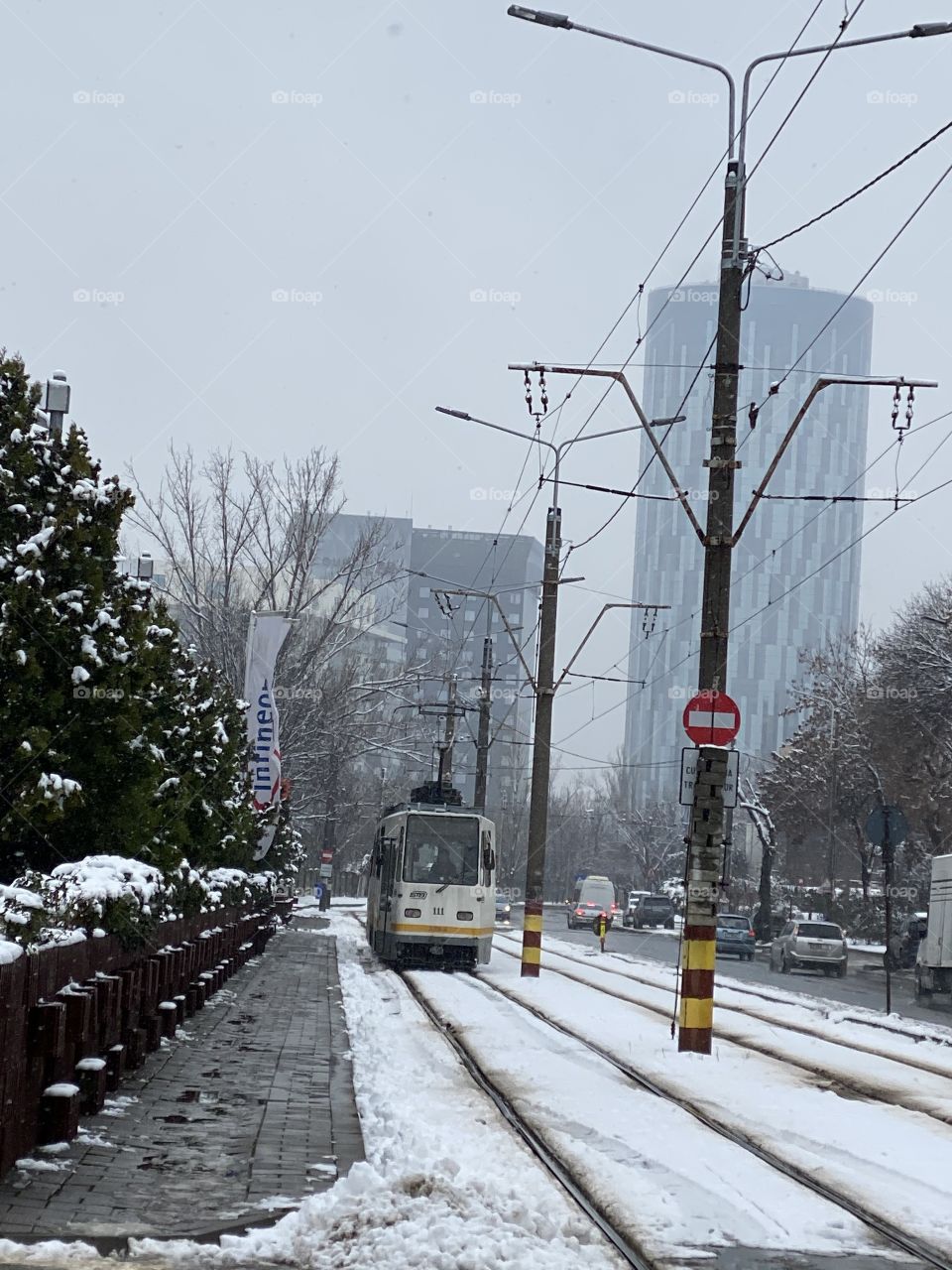 A city, an old tram and a little snow...