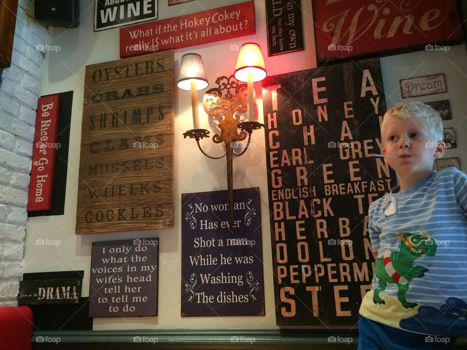 Boy standing in restaurant