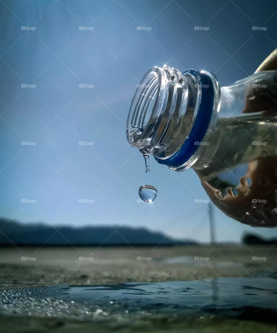 beautiful water drop falling from bottle