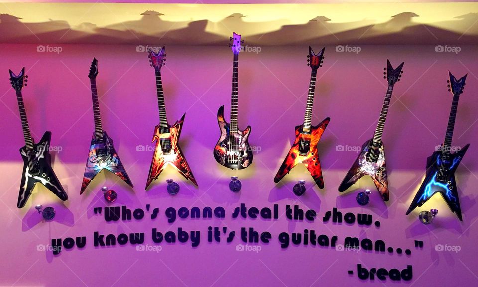 Color Purple - Seven Guitars on purple background 