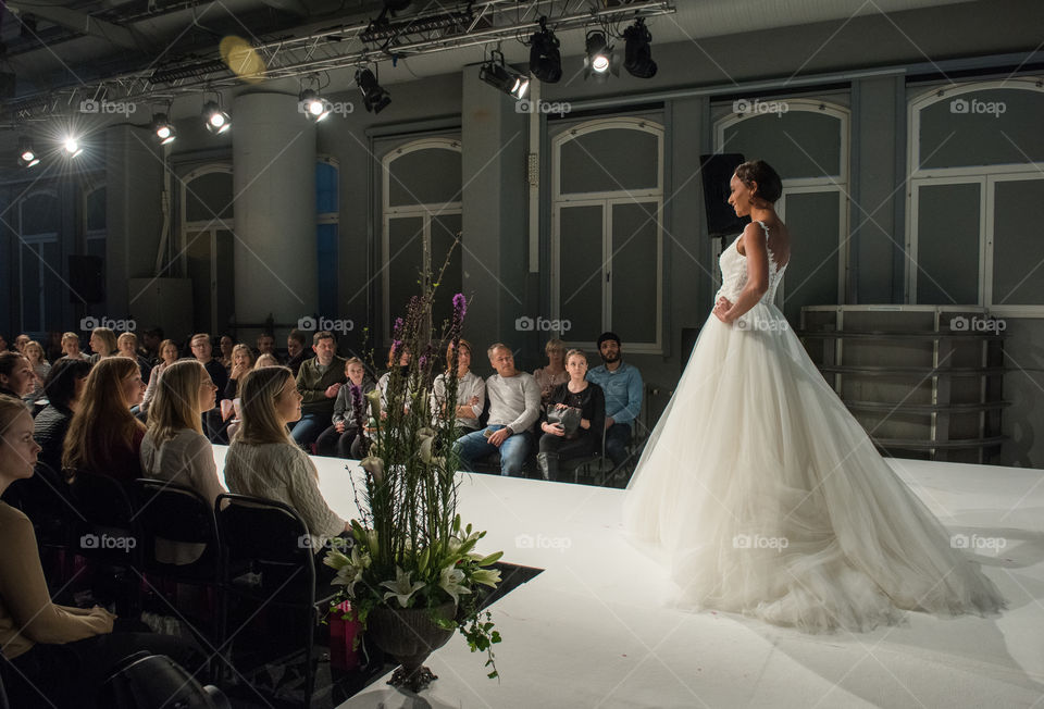 Fashion show at a wedding fair. Here are the latest dresses and clothes for both bride and groom.