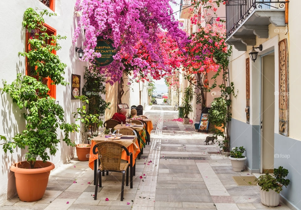 Restaurant by street in Greece. Beautiful street in Greece with restaurants and shops 