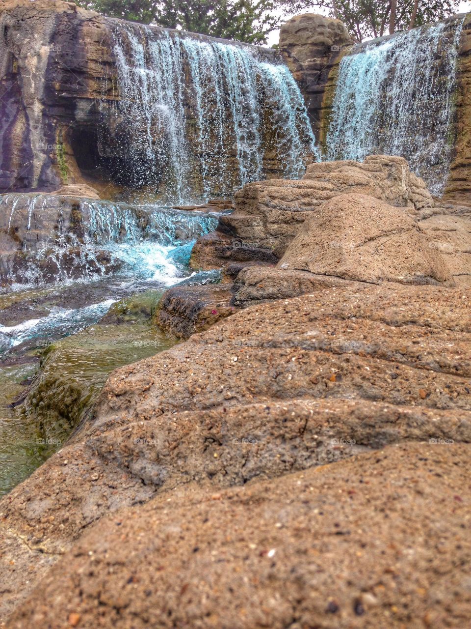 Summer views. Waterfall at mini golf course