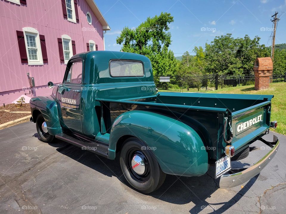 restored green Chevy on a sunny day in Missouri