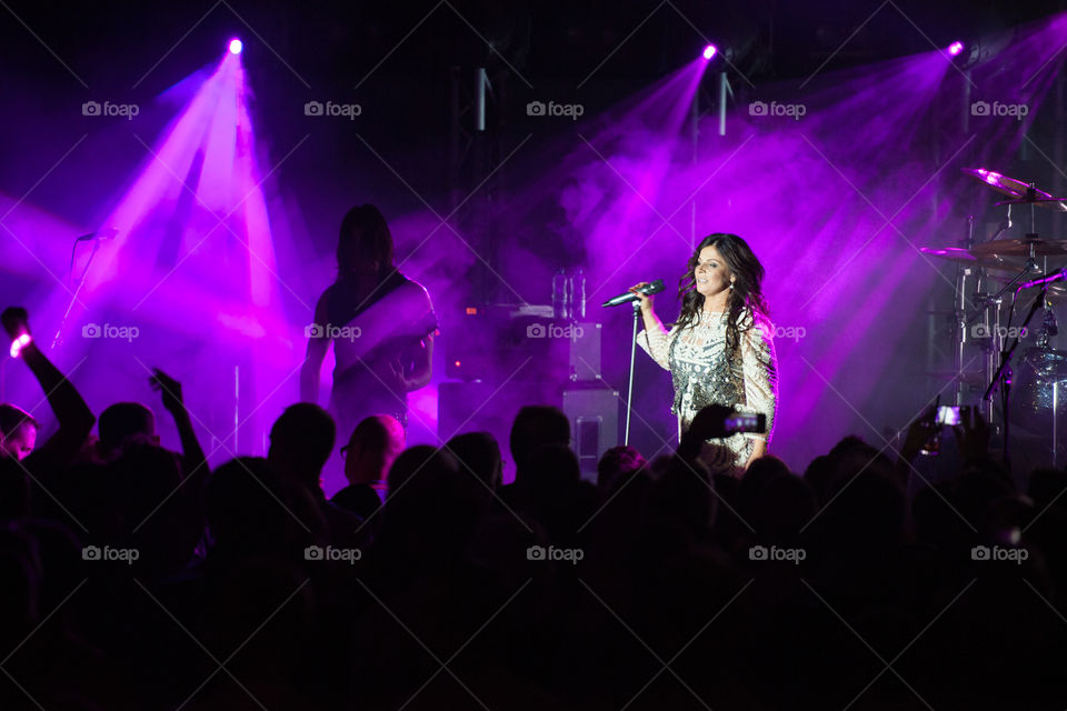 Swedish superstar Carola Häggkvist performing on stage in a nightclub in Malmö.