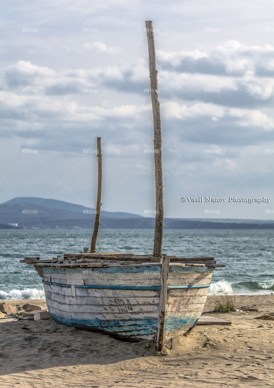 The lonely boat on the beach