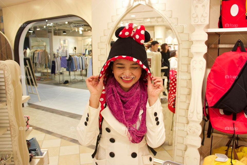 Trying on Disney hats