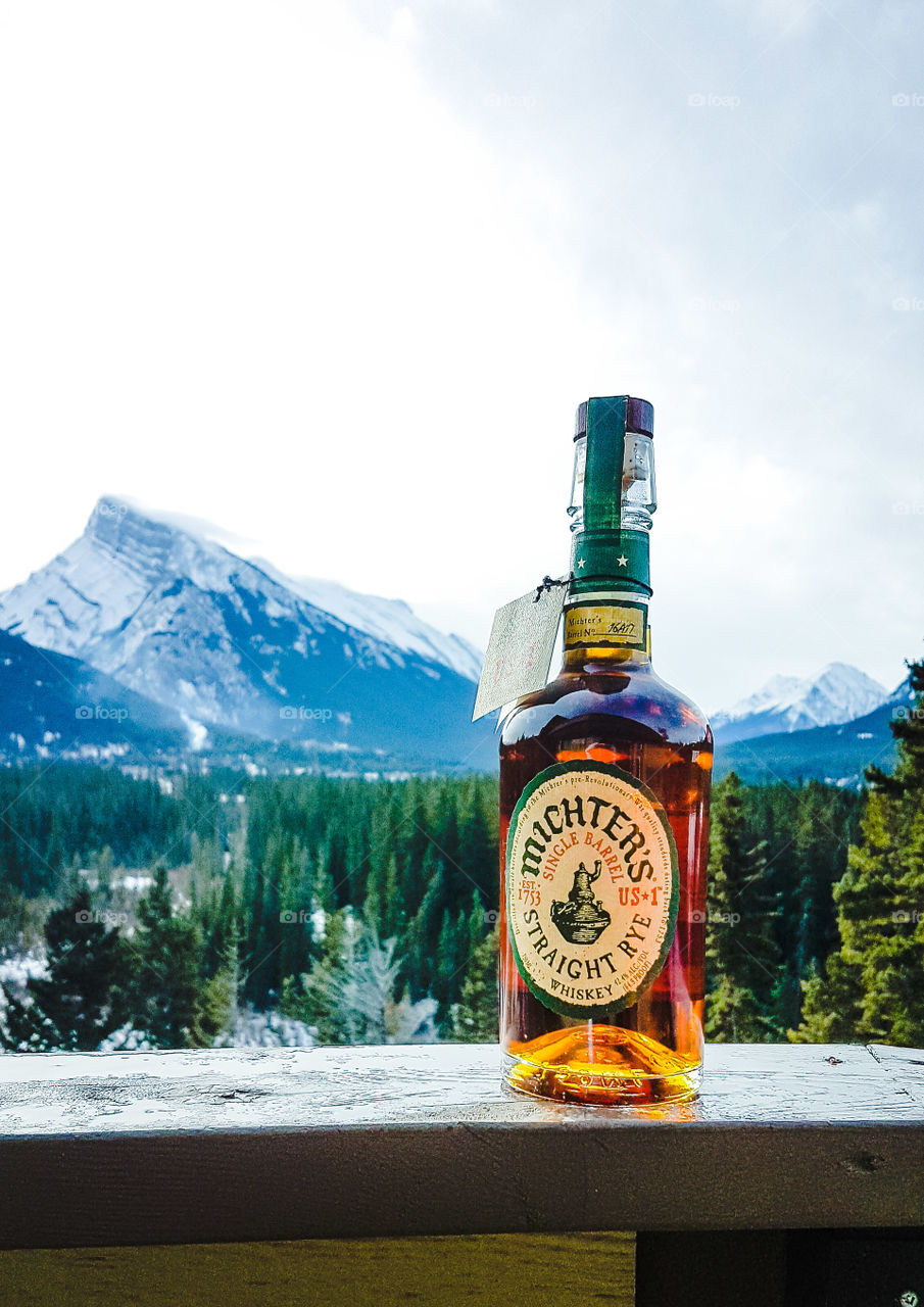 whiskey bottle in the mountains in Banff, Alberta, Canada