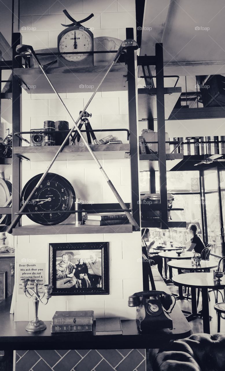 Antique items on display at the Coco Cubano Cafe, University of New South Wales, Australia. Monochrome image.