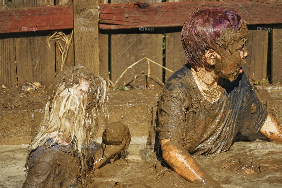 Boys Playing In Mud