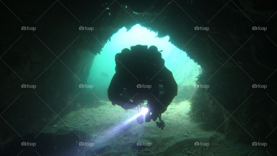 scuba diver in a cave