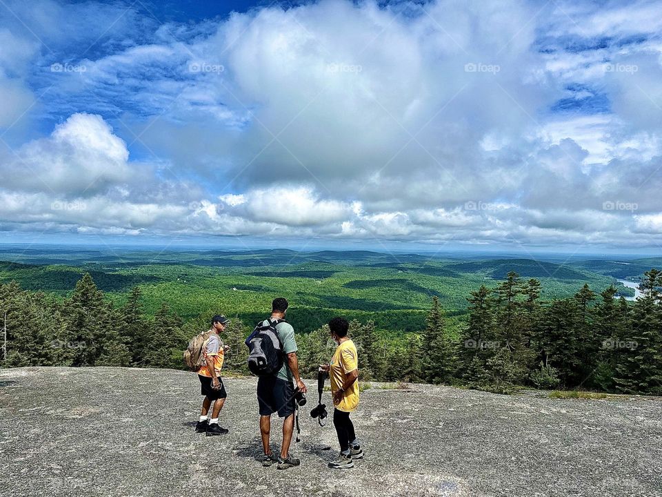 Family hiking Bald mountain in Dedham Maine 