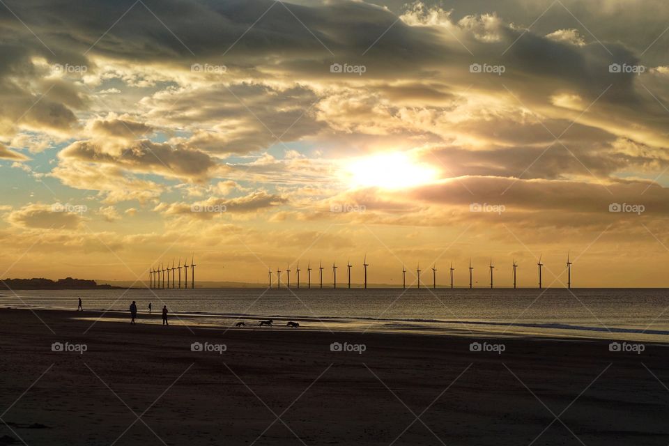 Beach stroll with a beautiful yellow sky ... Redcar wind turbines 