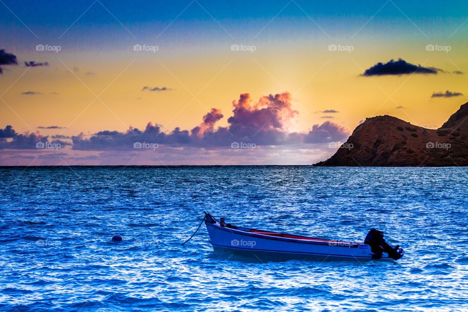 Fishing boat at sunrise. 