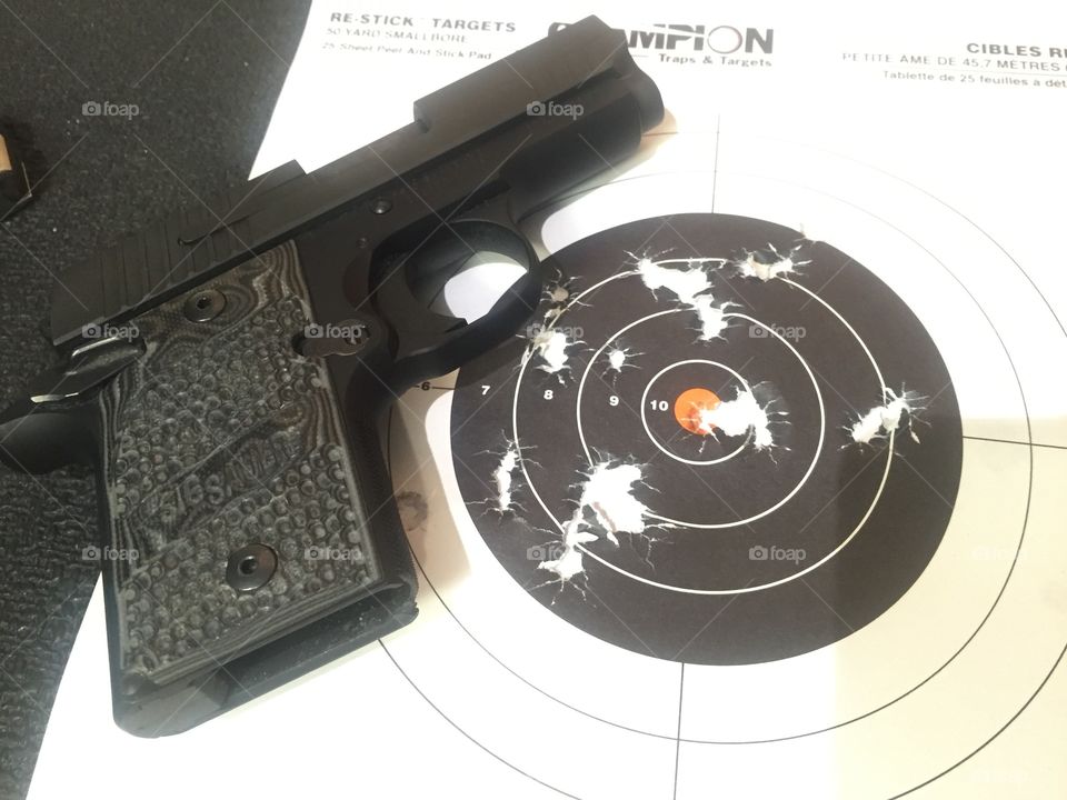 Sig P938 with shooting target. 