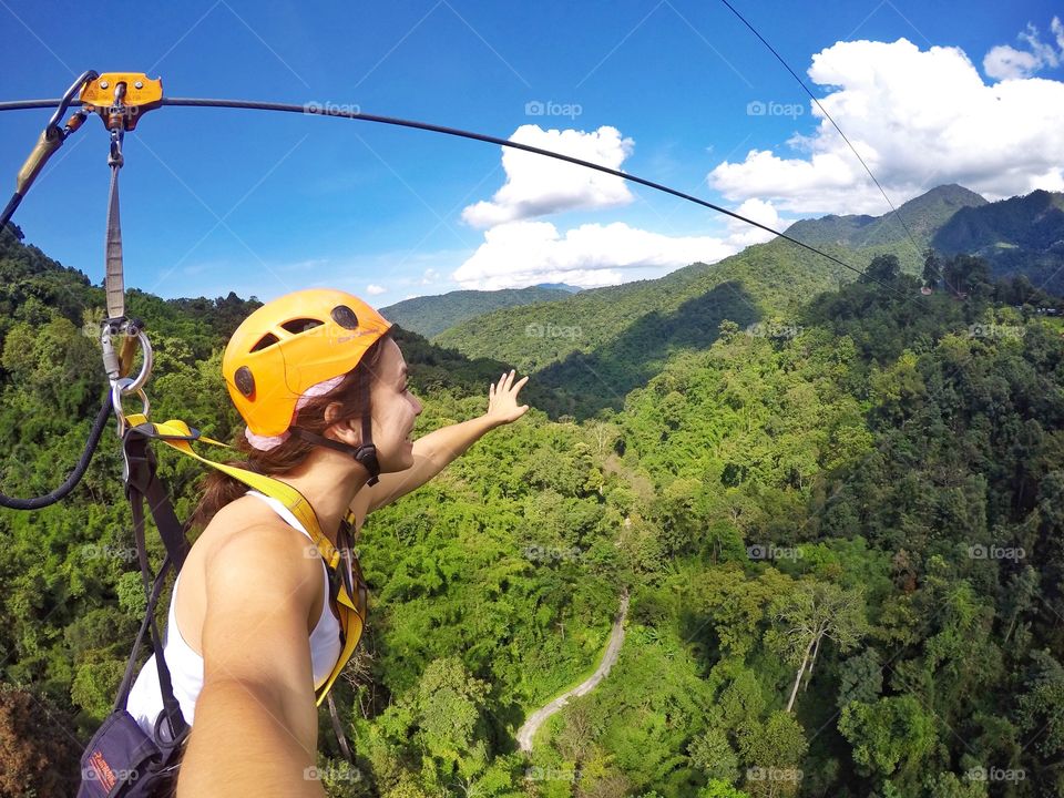 Zip lining through jungles of Thailand 