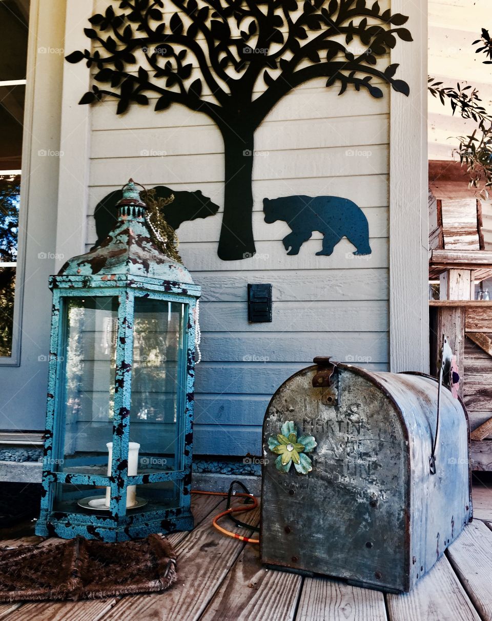 An old lamp and mailbox outside the house