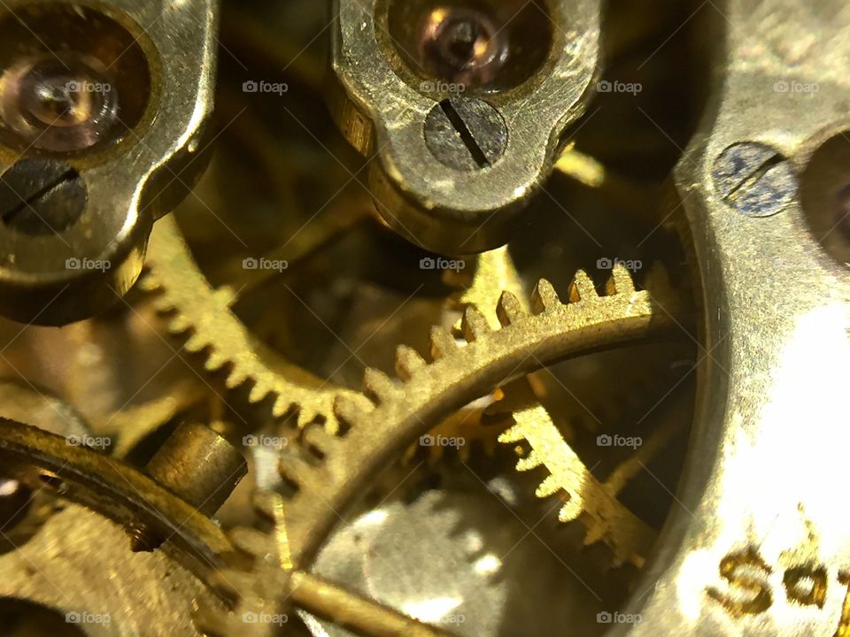 Inside mechanisms of an antique hand clock