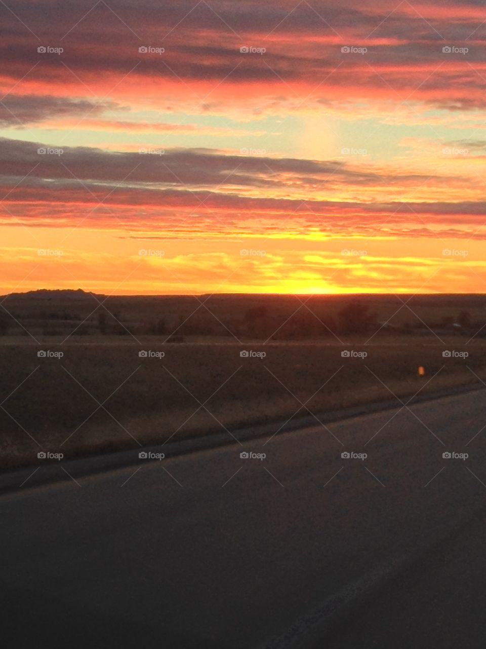The work commute across the state and not a soul in sight, but South Dakota sunsets never disappoint. 