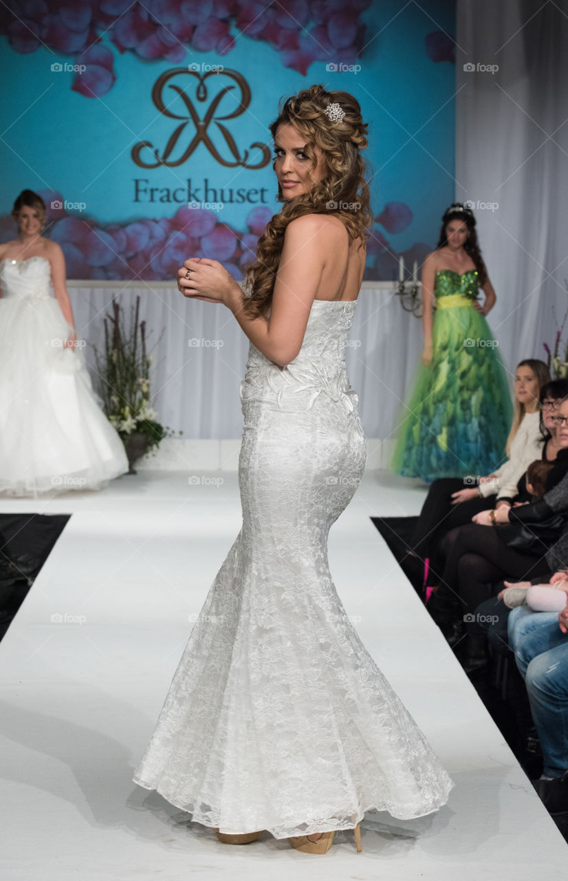 Fashion show at a wedding fair. Here are the latest dresses and clothes for both bride and groom.