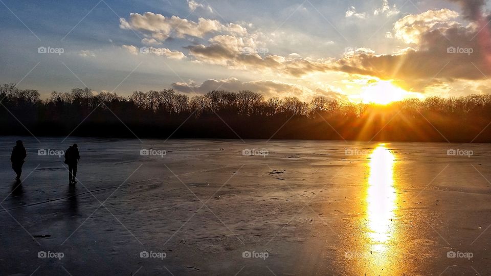 standing on frozen lake