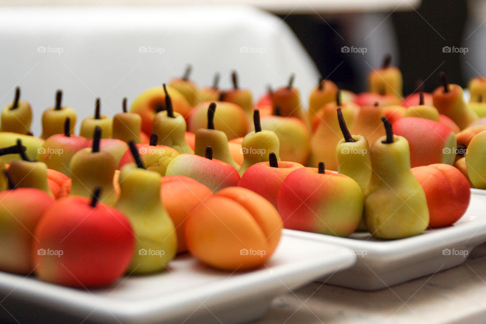 Marzipan desserts in the shape of pears and apples