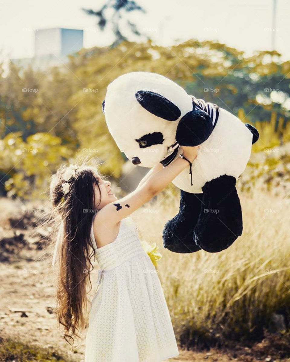 The little princess breaks the boundaries of happiness and rejoices and plays with the big doll. It was picked up in the air when the doll in the air and carry to heaven and the princess breaks the limits of happiness