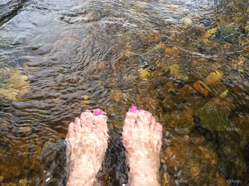 Feet in River