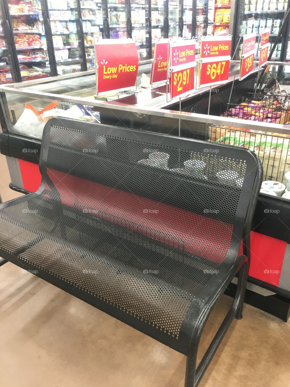 My husband calls this the hot flash bench. It is next to refrigerated cases in Walmart 