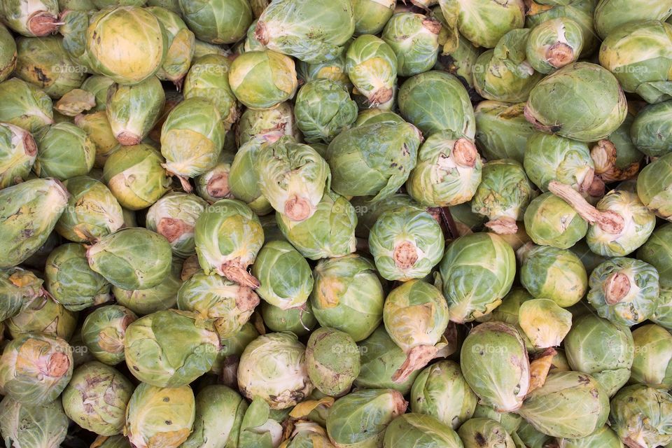 Many  Brussels sprouts at an outside fruit and vegetable market in Brooklyn, New York City,
