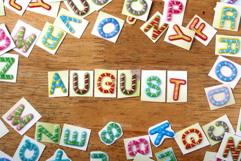 the word august. the word august spelled in colorful letters